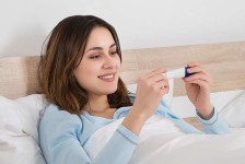 Young Woman Checking Pregnancy Test